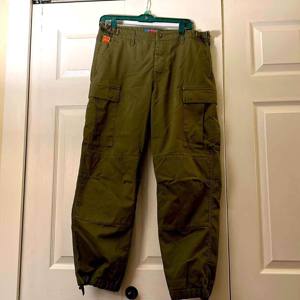 Empyre baggy pant, olive green, with drawstring ankle and button fly.